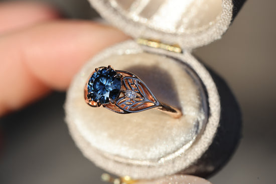 Elvindell three stone with 7mm dark blue moissanite