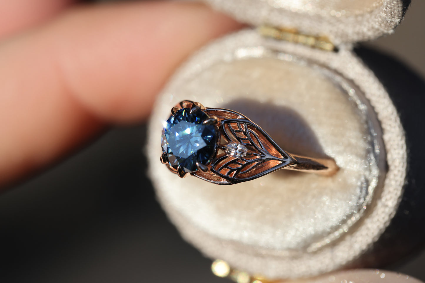 Elvindell three stone with 7mm dark blue moissanite