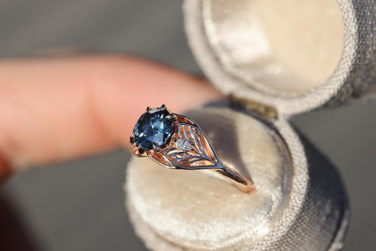 Elvindell three stone with 7mm dark blue moissanite