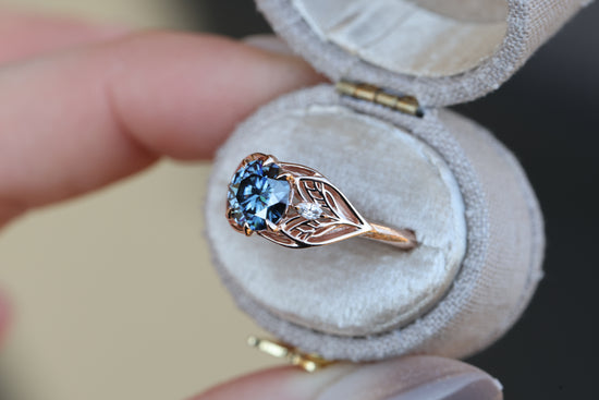 Elvindell three stone with 7mm dark blue moissanite