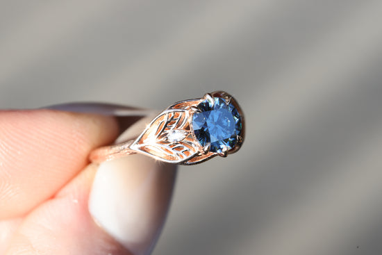 Elvindell three stone with 7mm dark blue moissanite