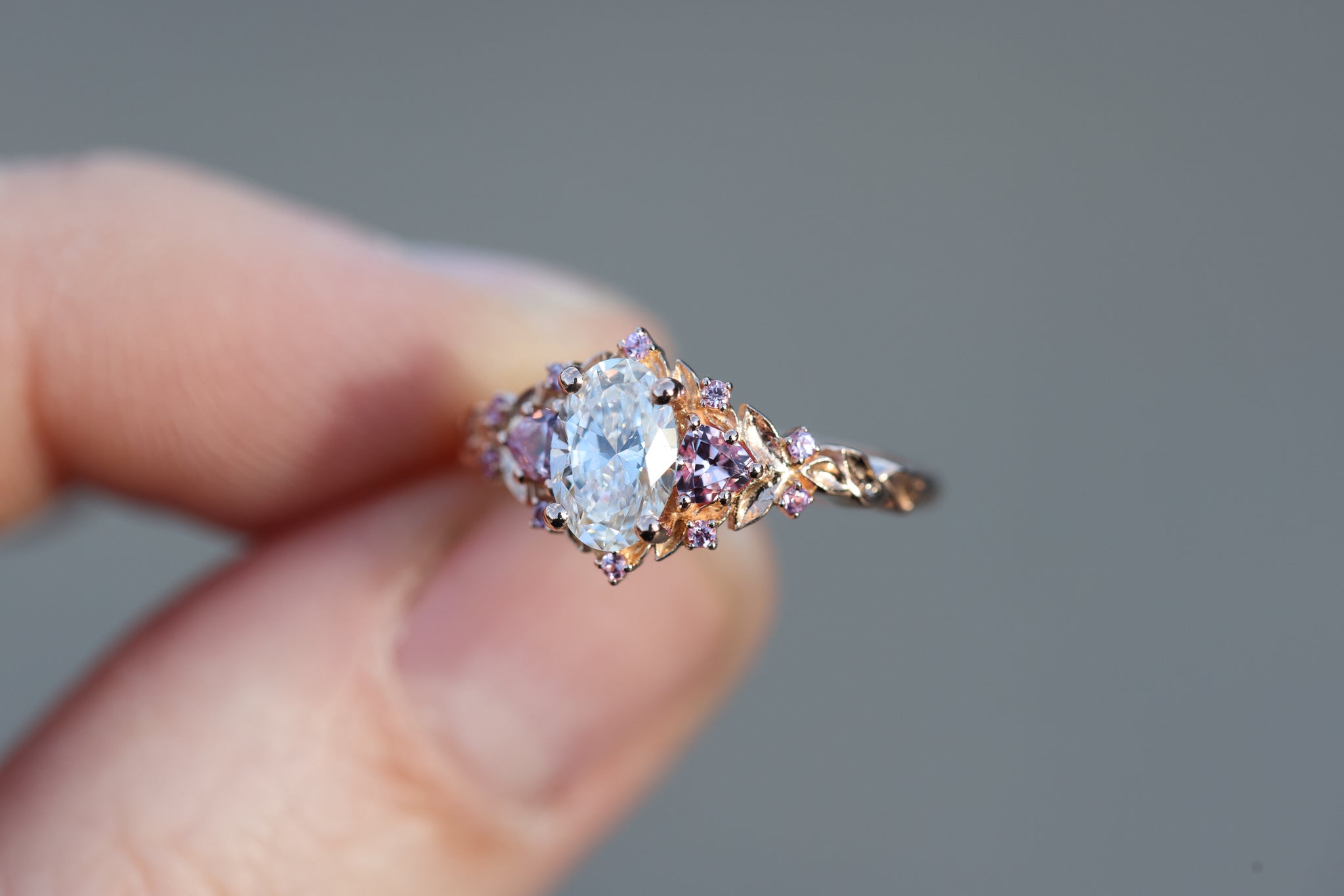 Briar rose three stone with 7x5mm oval lab diamond center and pink