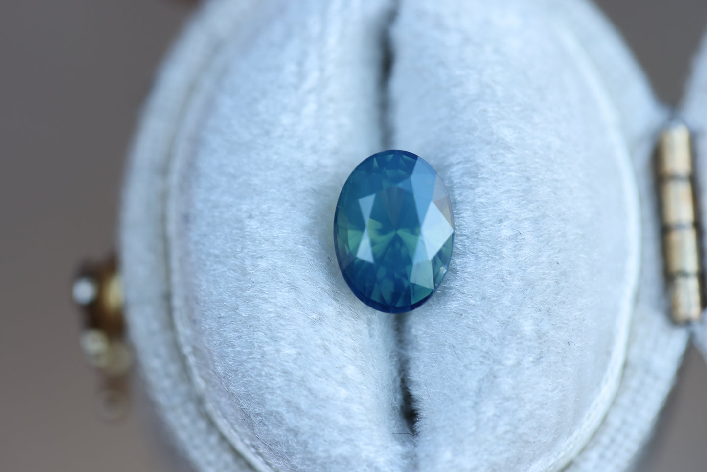 1.72ct oval opalescent teal blue sapphire