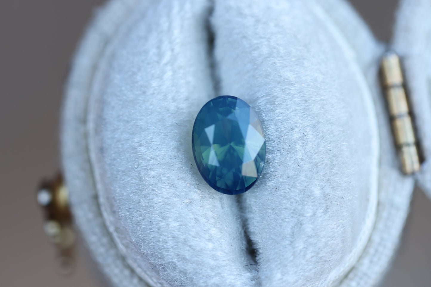 1.72ct oval opalescent teal blue sapphire