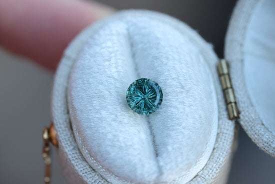 1.22ct round teal sapphire- Starbrite cut by John Dyer