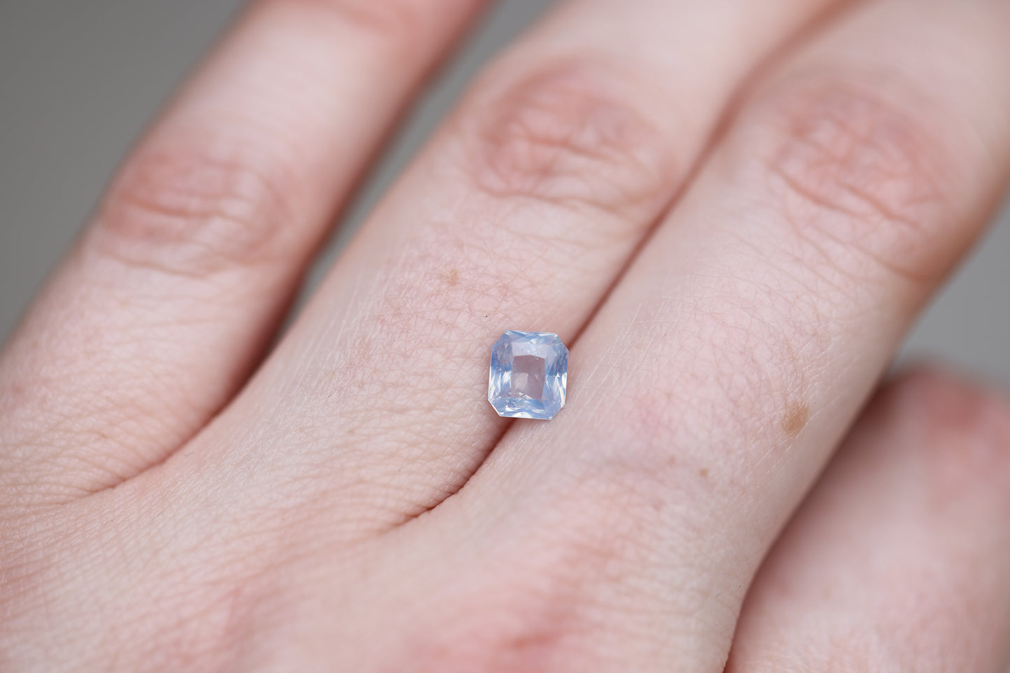 1.07ct Emerald Cut Opalescent Light Blue with a Hint of Lavender