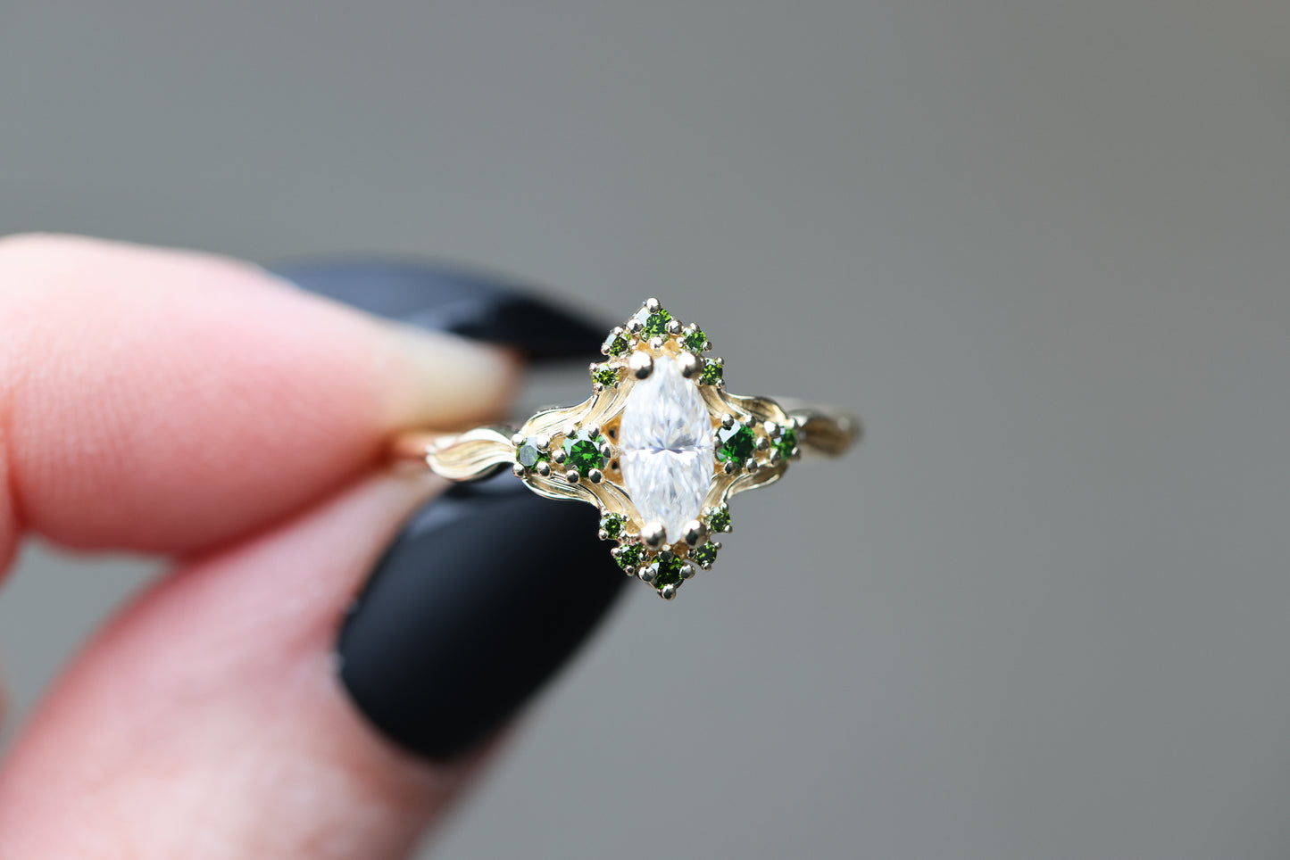 Astraea half halo with marquise moissanite and dark green irradiated diamonds