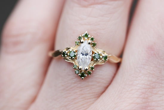 Astraea half halo with marquise moissanite and dark green irradiated diamonds