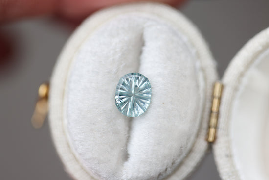ON HOLD .87ct oval pale blue teal sapphire - Starbrite cut by John Dyer
