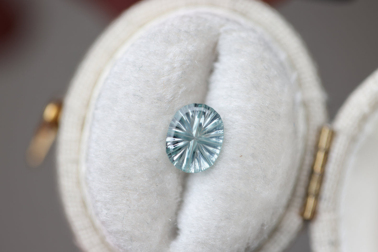 ON HOLD .87ct oval pale blue teal sapphire - Starbrite cut by John Dyer