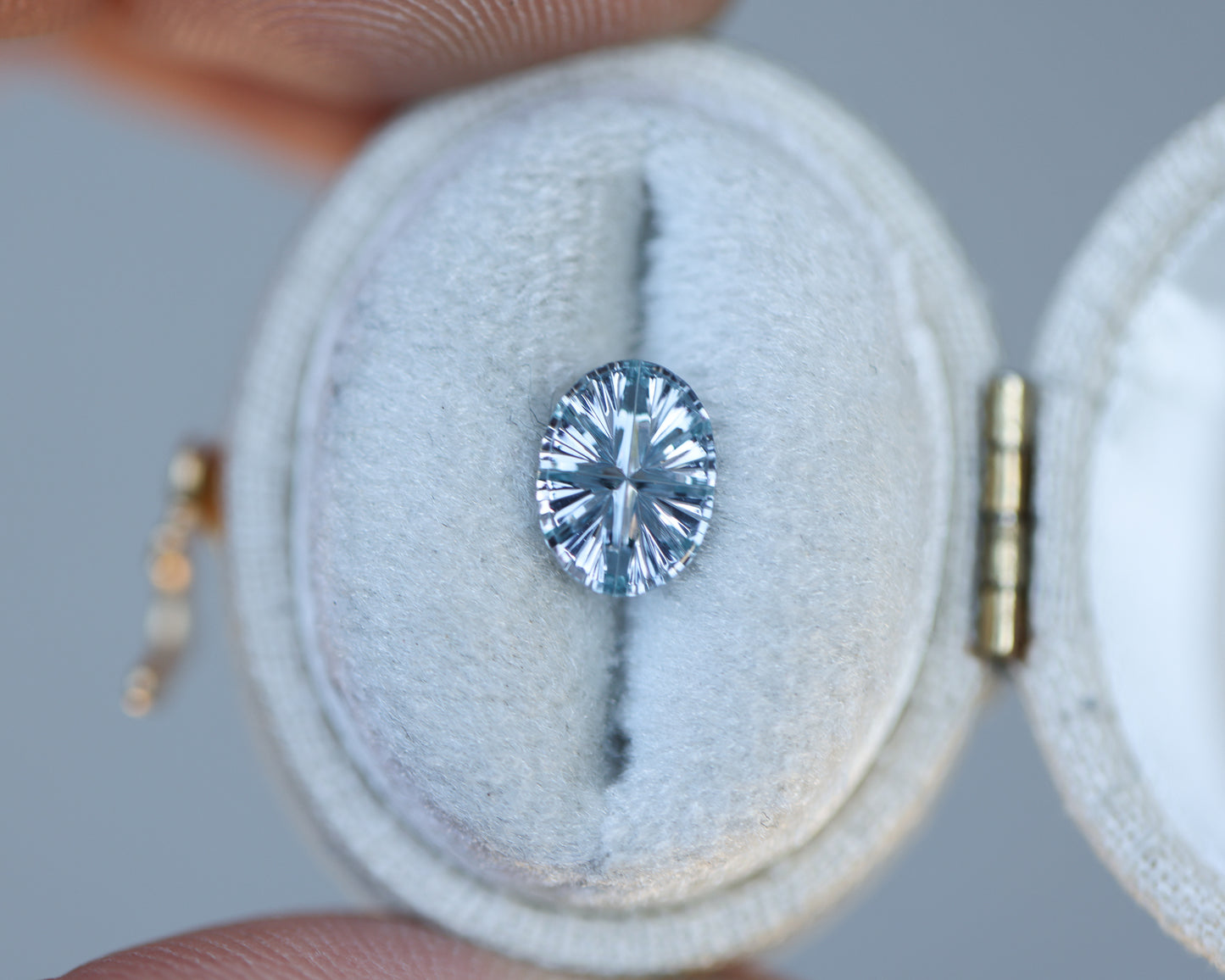 .92ct oval color change from light blue to a very light purple sapphire, Starbrite cut by John Dyer