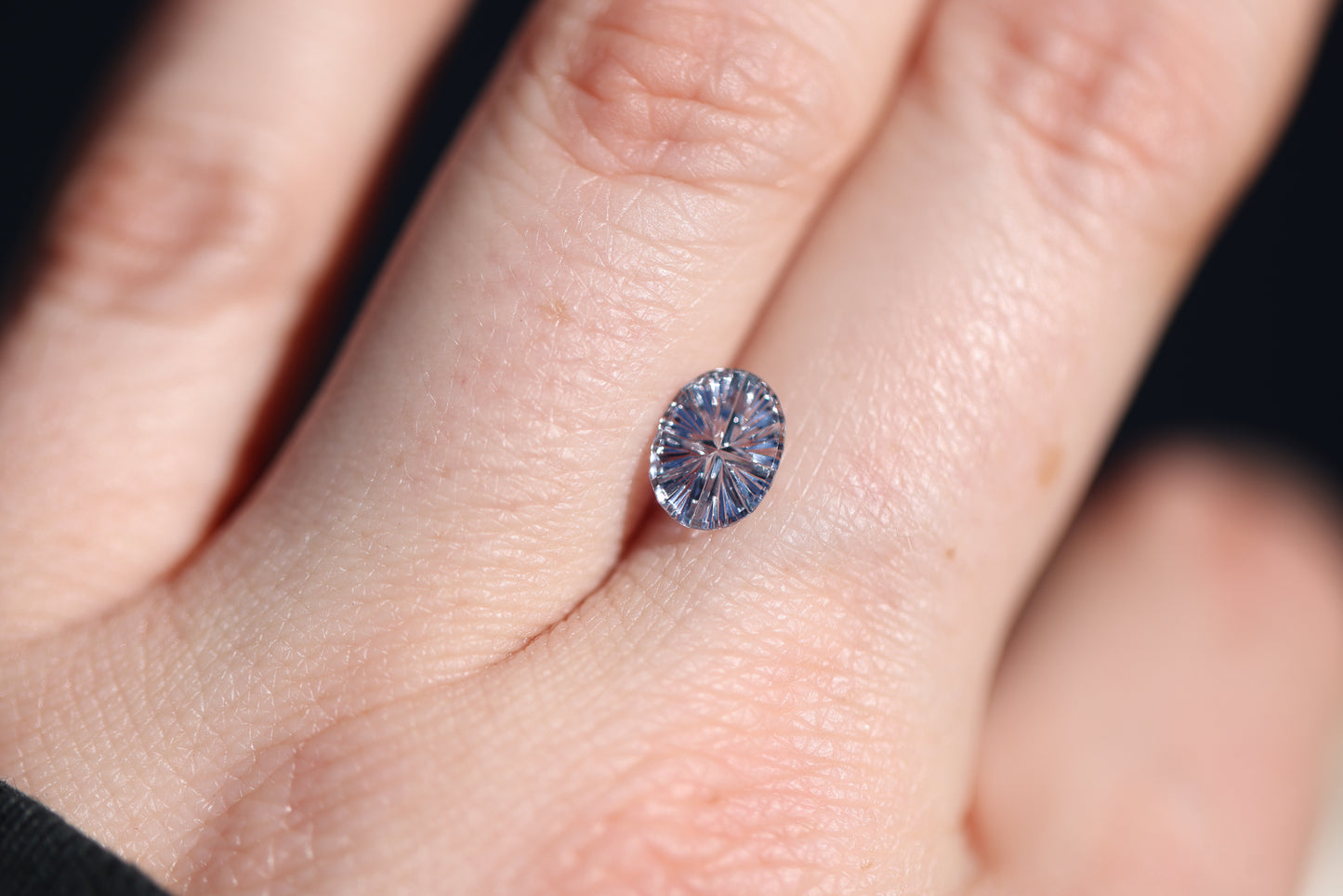 .92ct oval color change from light blue to a very light purple sapphire, Starbrite cut by John Dyer