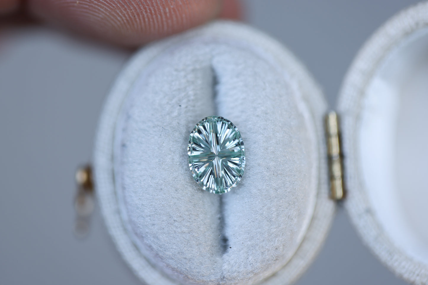 1.14ct oval light green grey sapphire, Starbrite cut by John Dyer