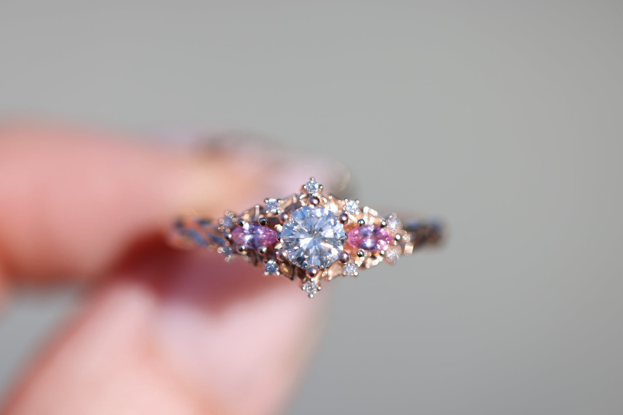 Briar Rose Three Stone with round moissanite and natural pink