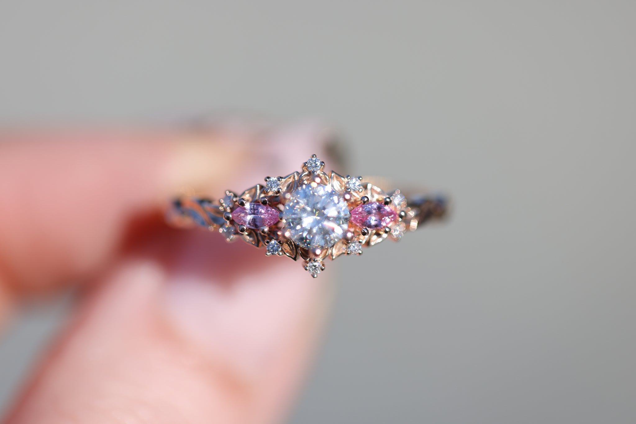 Briar Rose Three Stone with round moissanite and natural pink