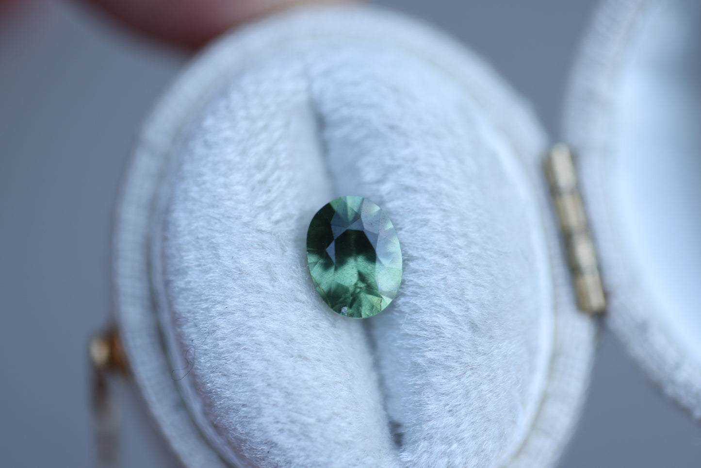 1.21ct oval opalescent green teal sapphire