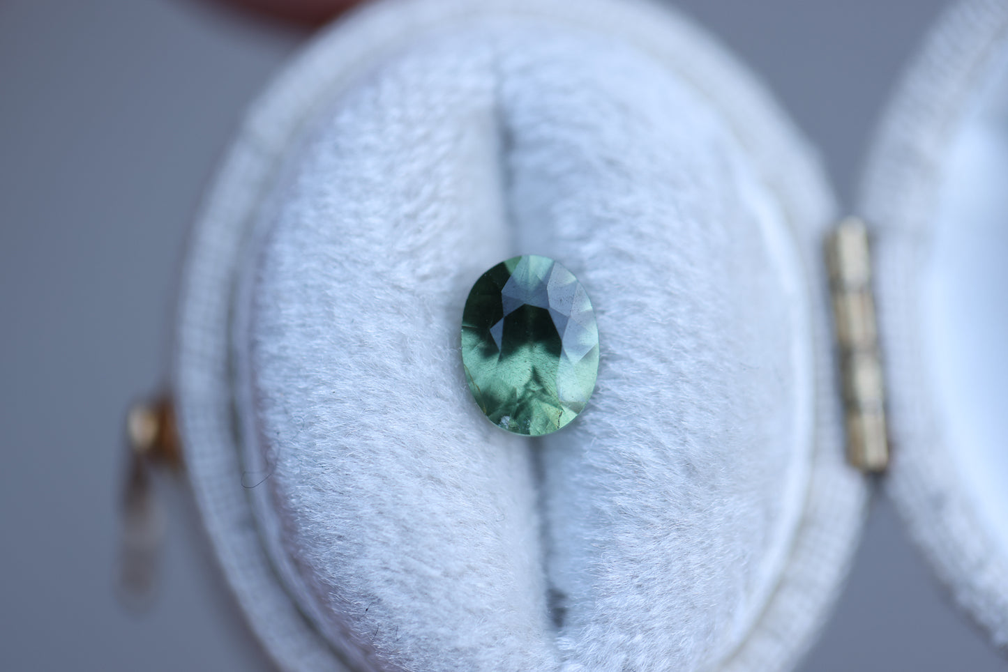 1.21ct oval opalescent green teal sapphire