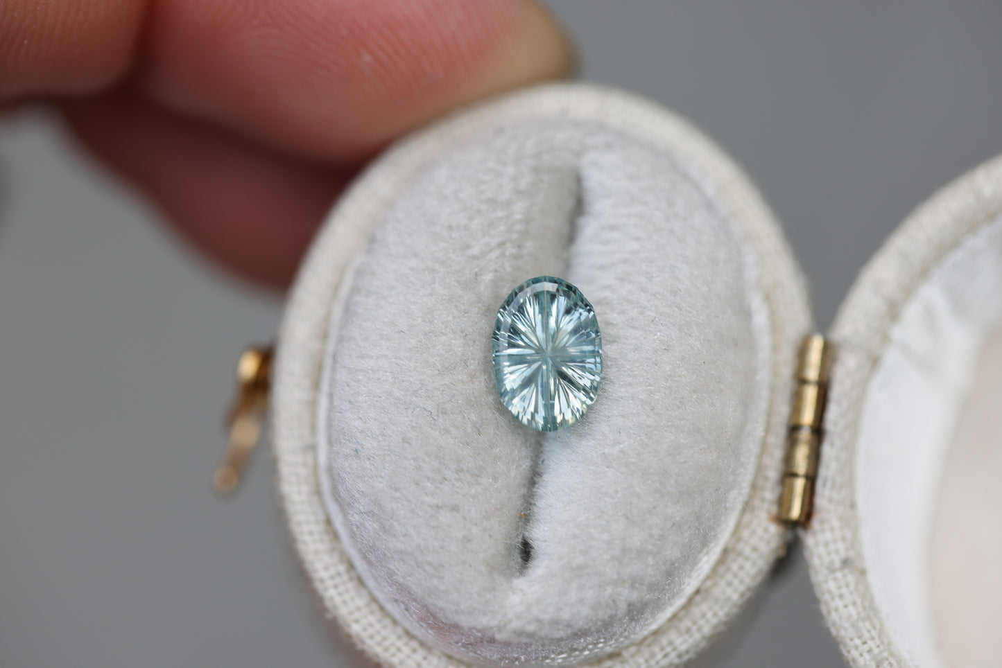 1.24ct oval icy light seafoam sapphire - Starbrite cut by John Dyer