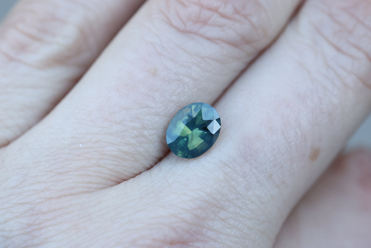 2.11ct oval opalescent teal green sapphire