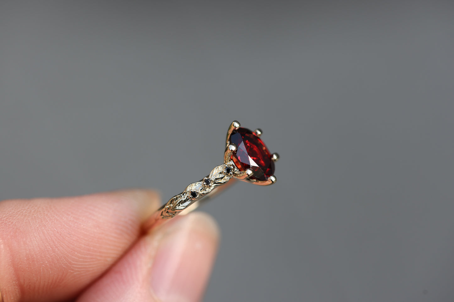 Rowan with 8x6mm Oval Garnet Center