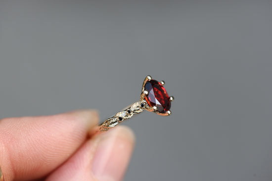 Rowan with 8x6mm Oval Garnet Center