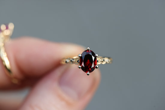 Rowan with 8x6mm Oval Garnet Center