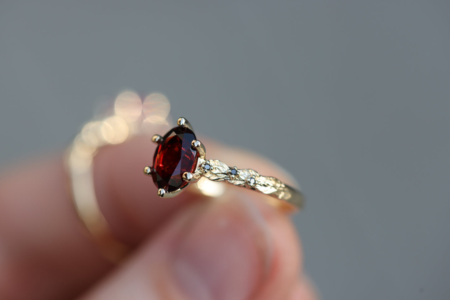 Rowan with 8x6mm Oval Garnet Center