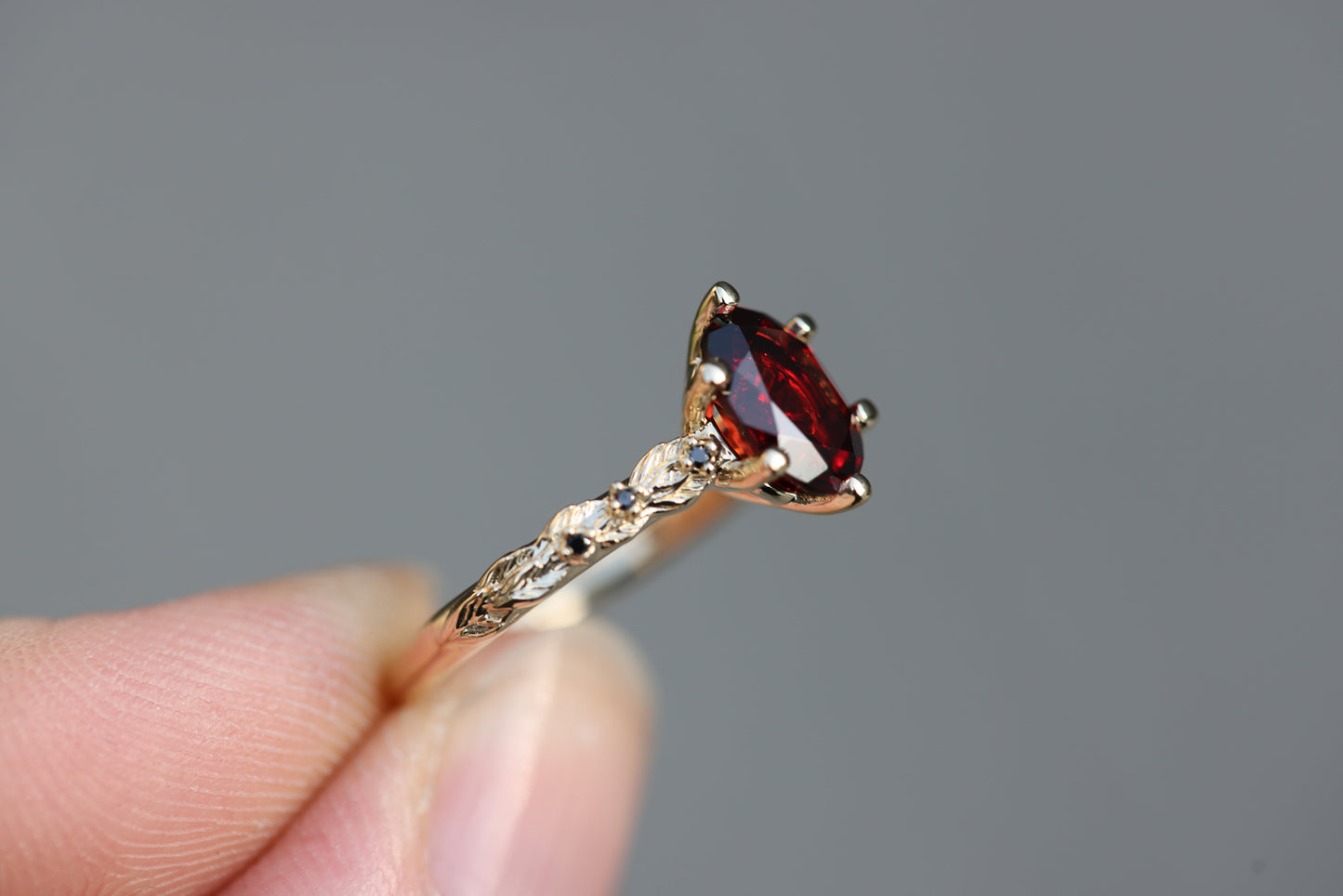 Rowan with 8x6mm Oval Garnet Center