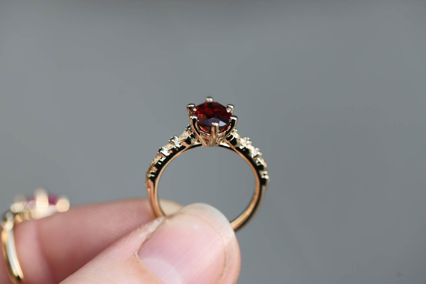 Rowan with 8x6mm Oval Garnet Center