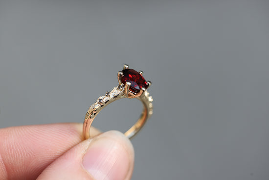 Rowan with 8x6mm Oval Garnet Center