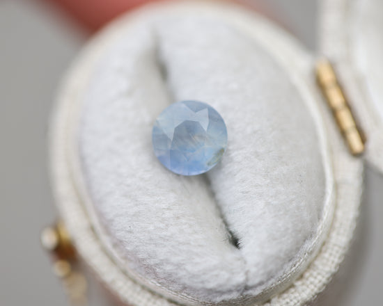 1.73ct round opalescent light blue sapphire