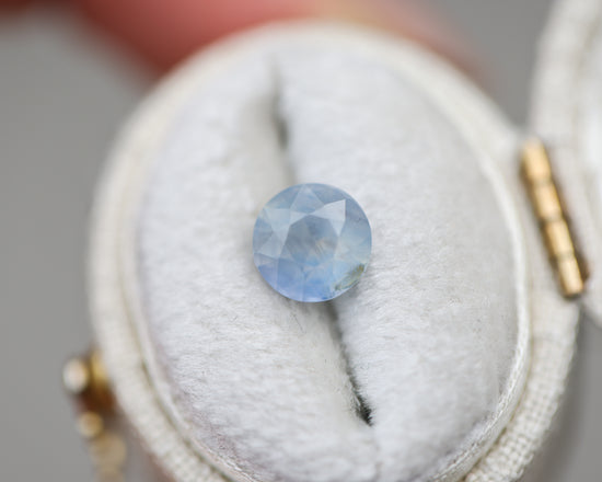 1.73ct round opalescent light blue sapphire