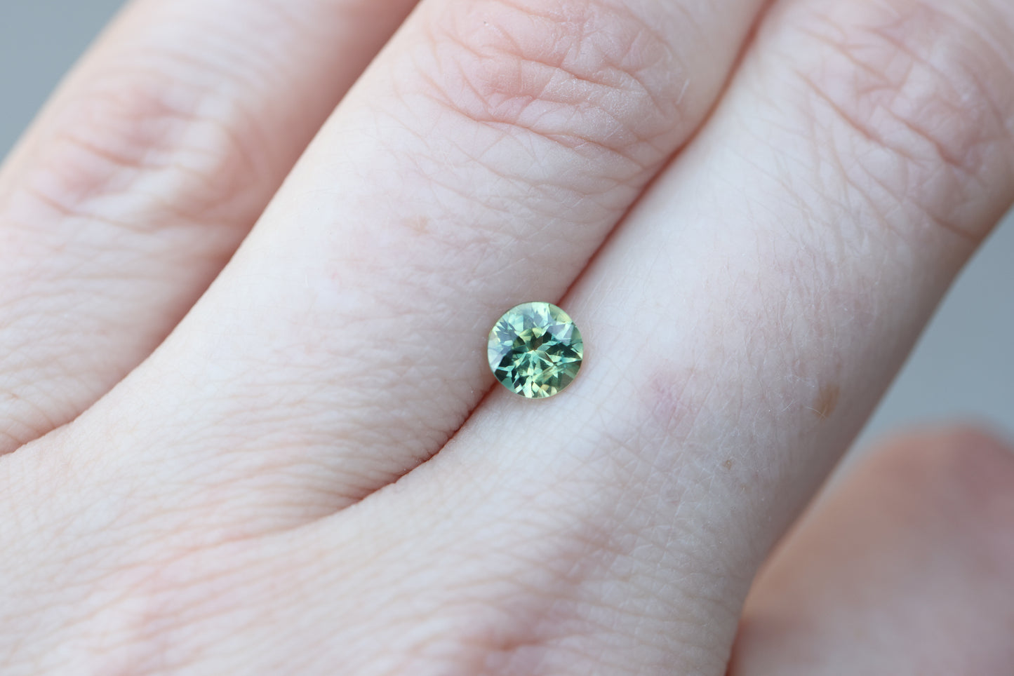.82ct round green yellow sapphire