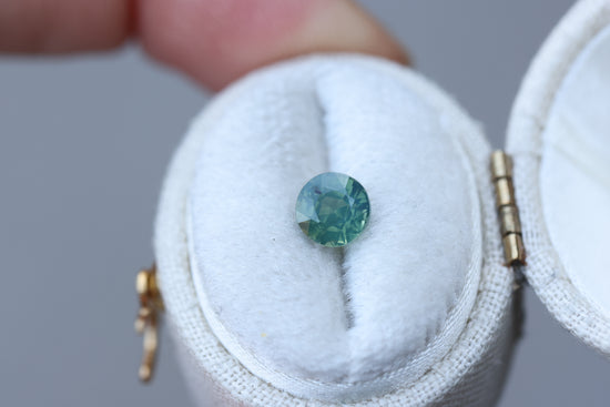 1.18ct round opalescent teal green sapphire