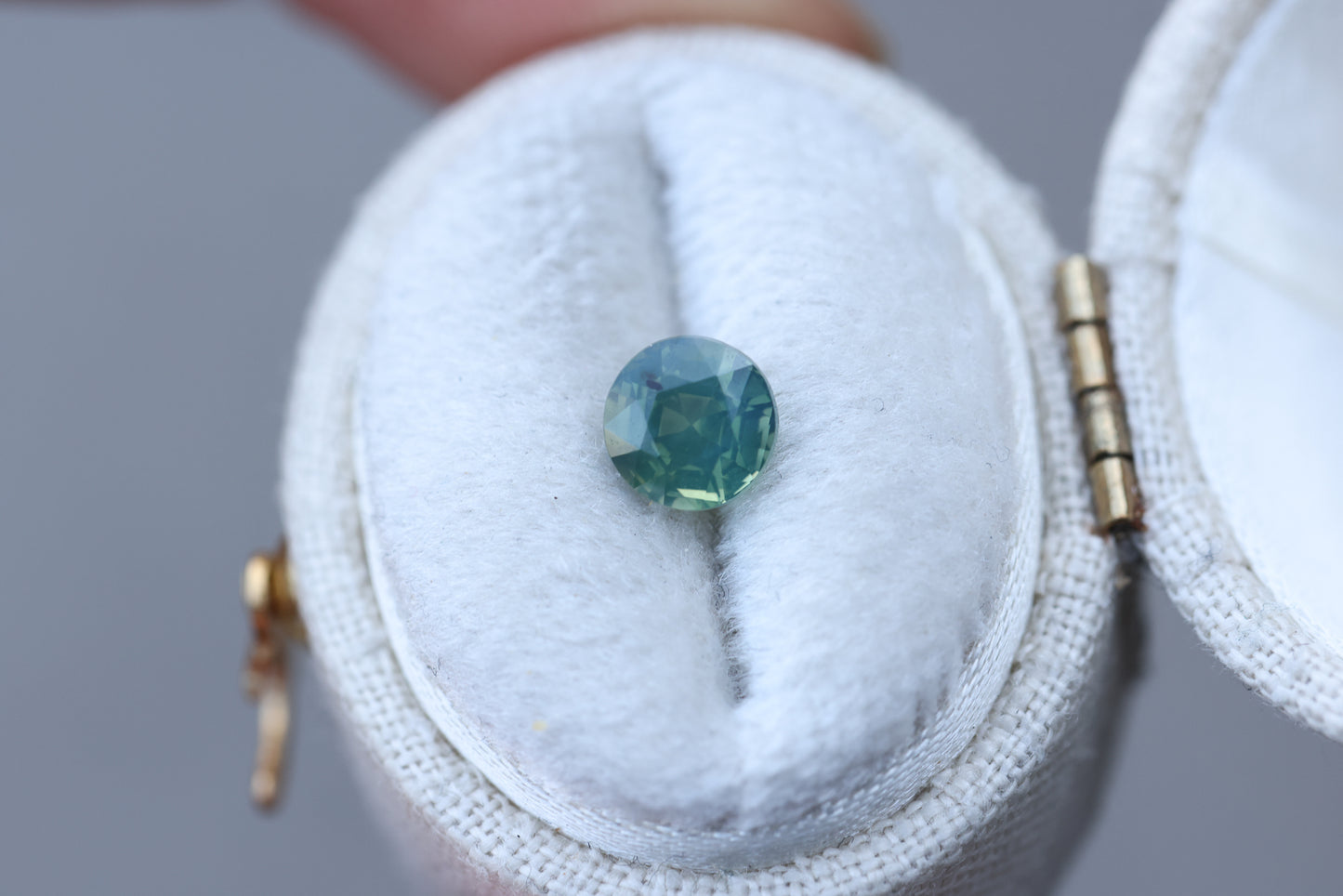 1.18ct round opalescent teal green sapphire