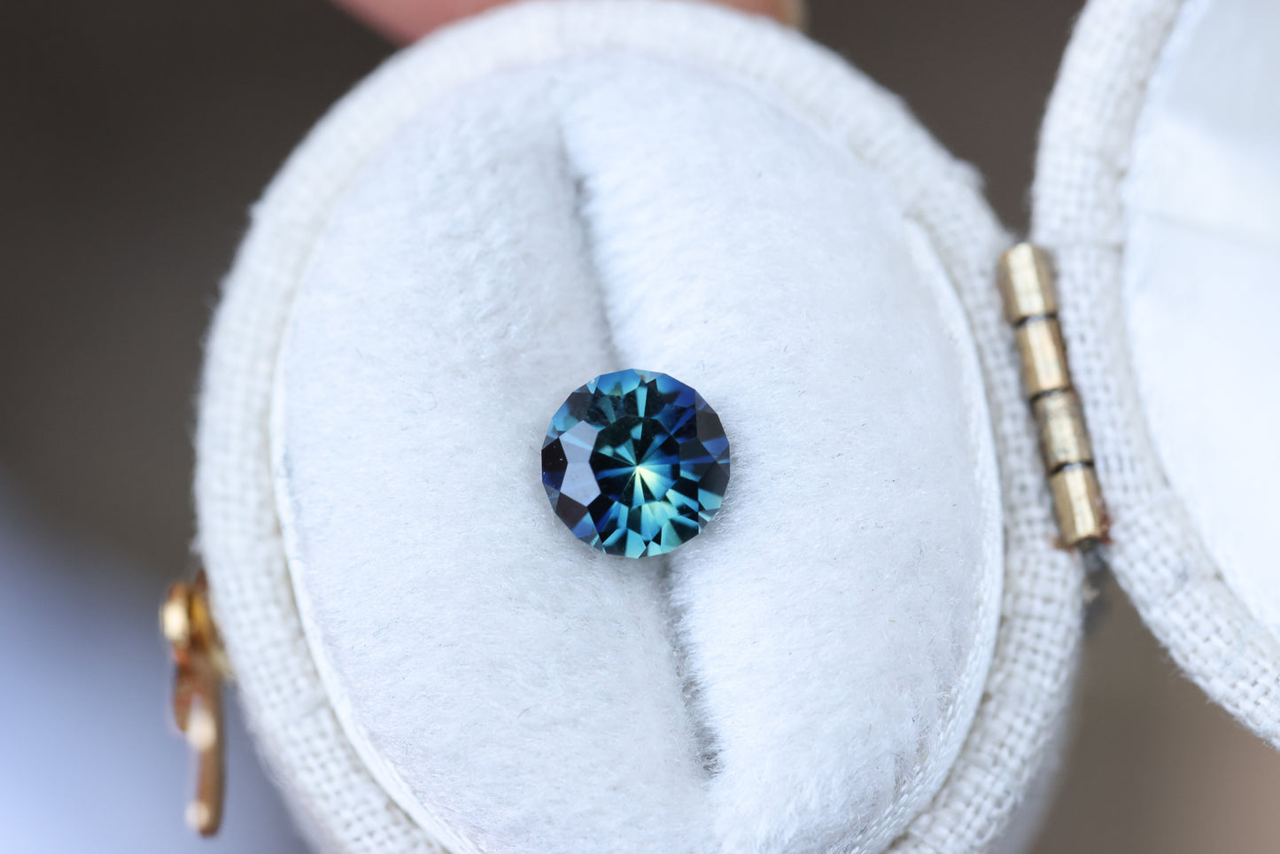 1.21ct round blue teal sapphire, Sunburst cut by John Dyer