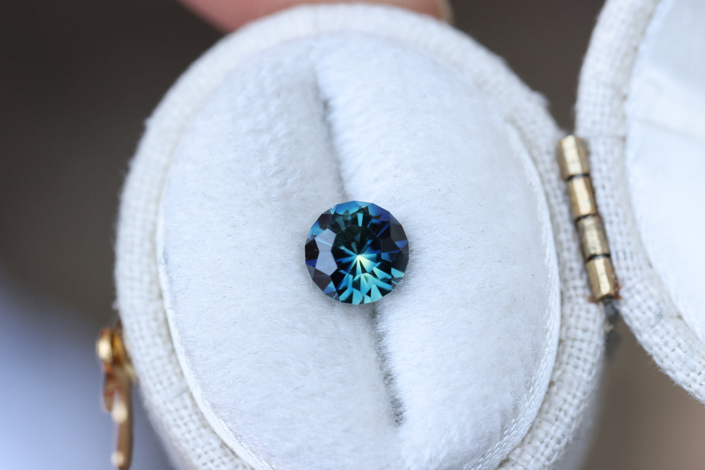 1.21ct round blue teal sapphire, Sunburst cut by John Dyer