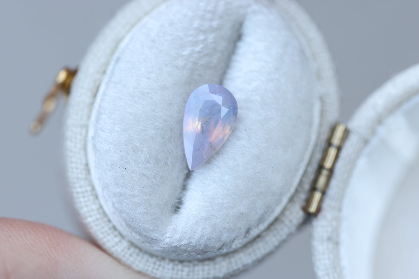 1.5ct pear opalescent light purple peachy sapphire