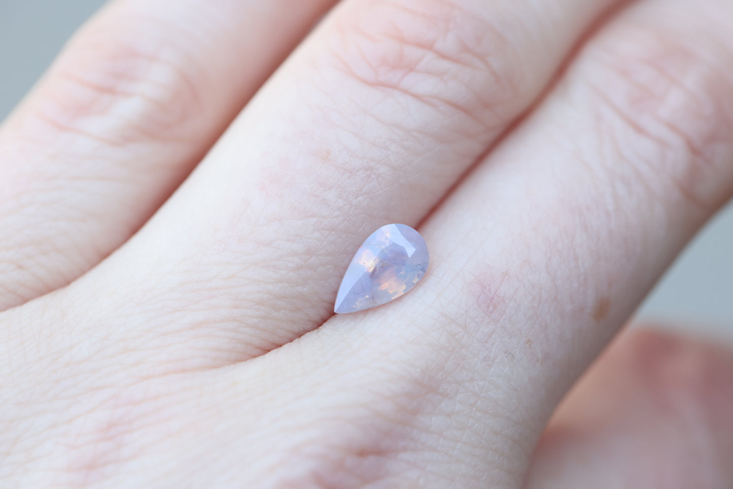 1.5ct pear opalescent light purple peachy sapphire