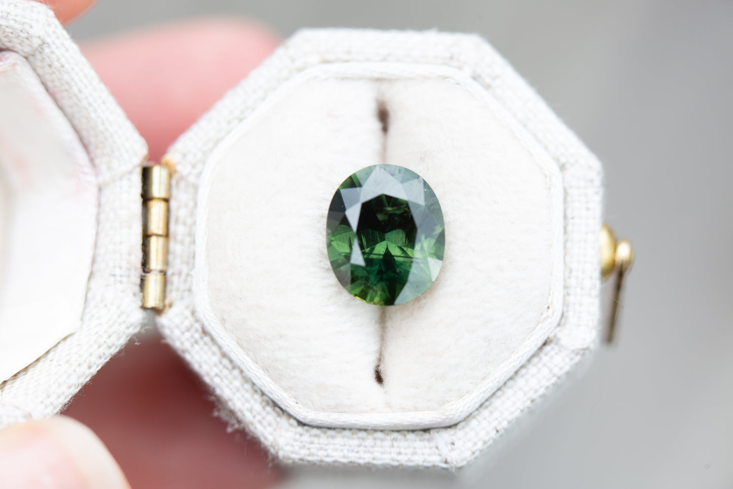 ON HOLD 3.05ct oval deep green sapphire