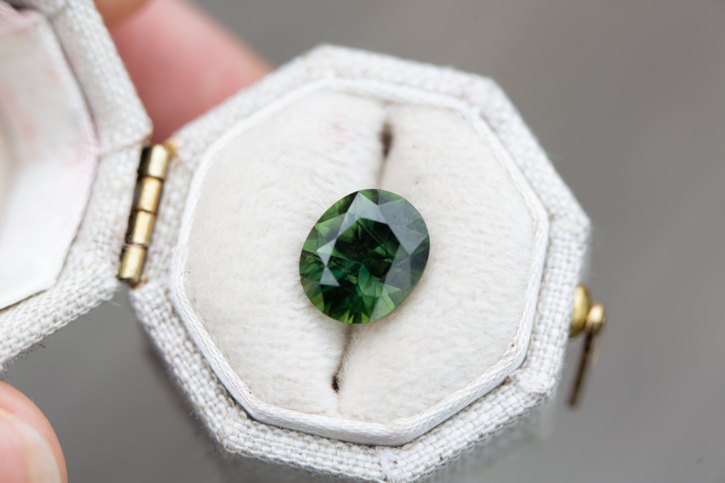 ON HOLD 3.05ct oval deep green sapphire
