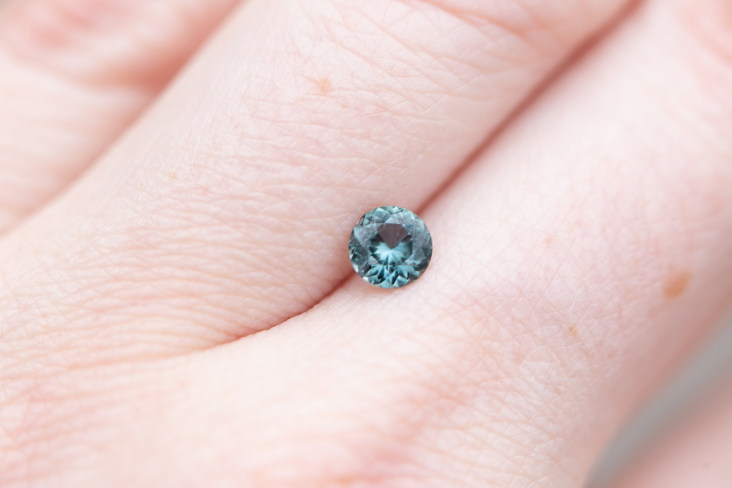 Load image into Gallery viewer, .57ct round blue green sapphire
