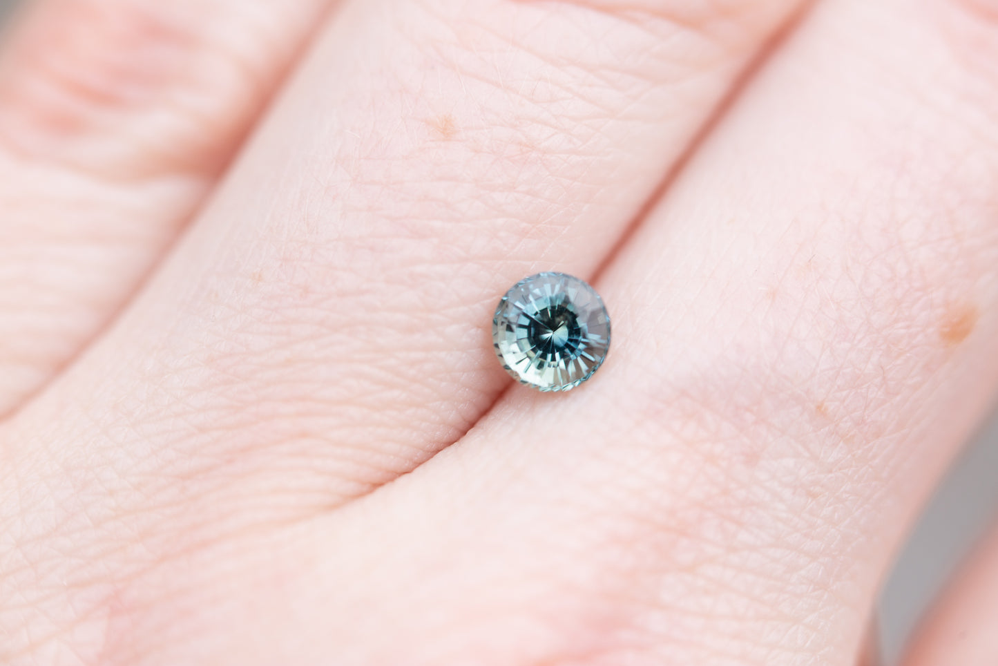 ON HOLD .85ct round blue green sapphire