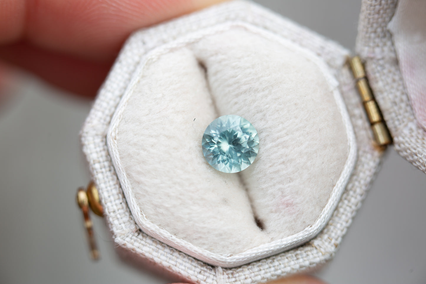 1.02ct round light teal blue sapphire