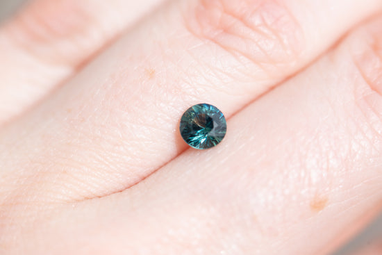 .82ct round deep blue green sapphire