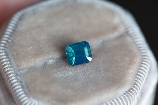 1.8ct opalescent blue green emerald cut sapphire