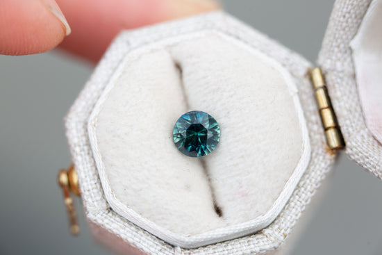 .82ct round deep blue green sapphire