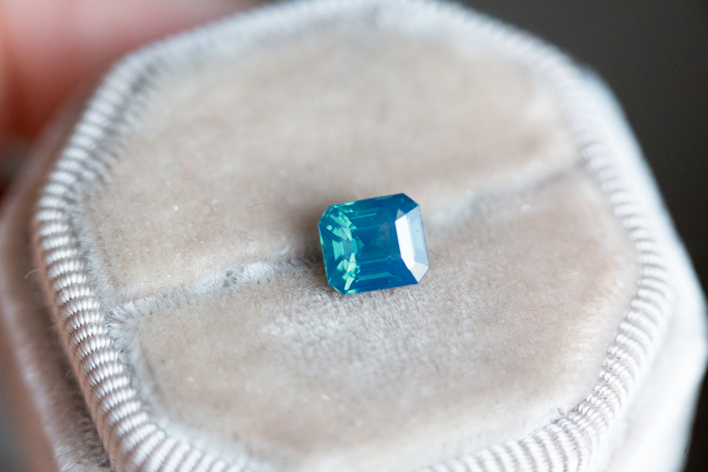 1.8ct opalescent blue green emerald cut sapphire