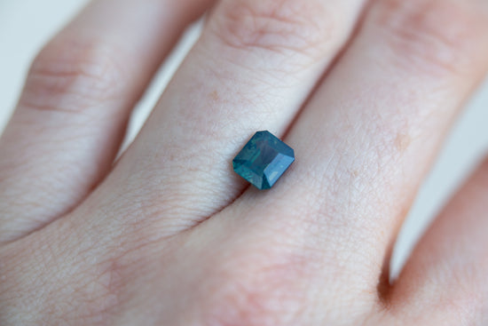 1.8ct opalescent blue green emerald cut sapphire