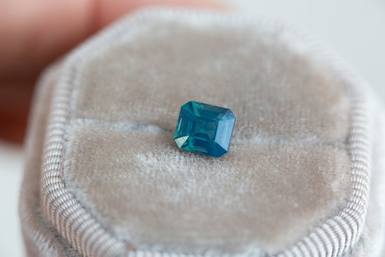 1.8ct opalescent blue green emerald cut sapphire